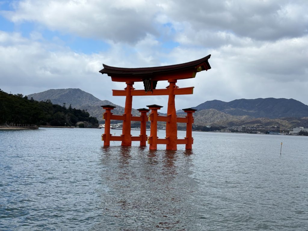 The iconic vermilion Great Torii Gate standing in the sea at Itsukushima Shrine