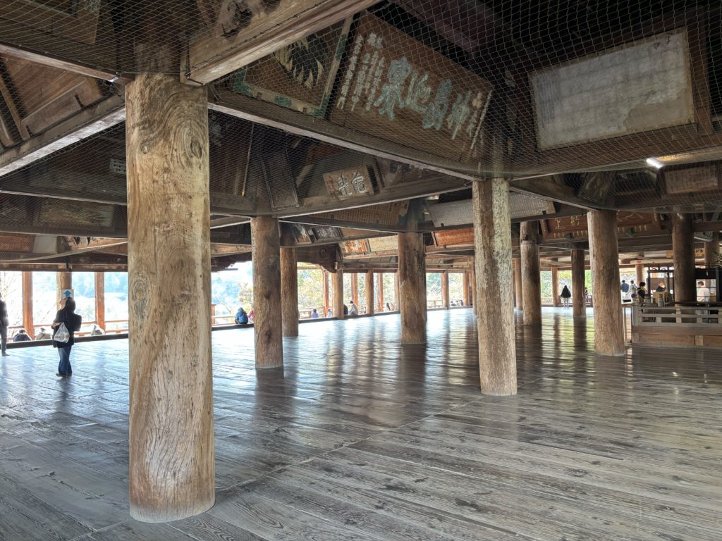 Inside Senjokaku Hall displaying colorful ema votive paintings and open architecture