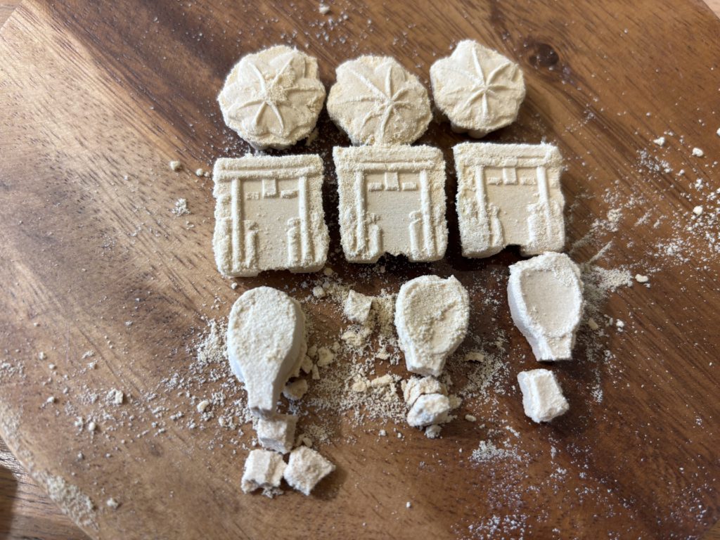 The moment of reveal as the perfectly formed dry sweet emerges from the mold