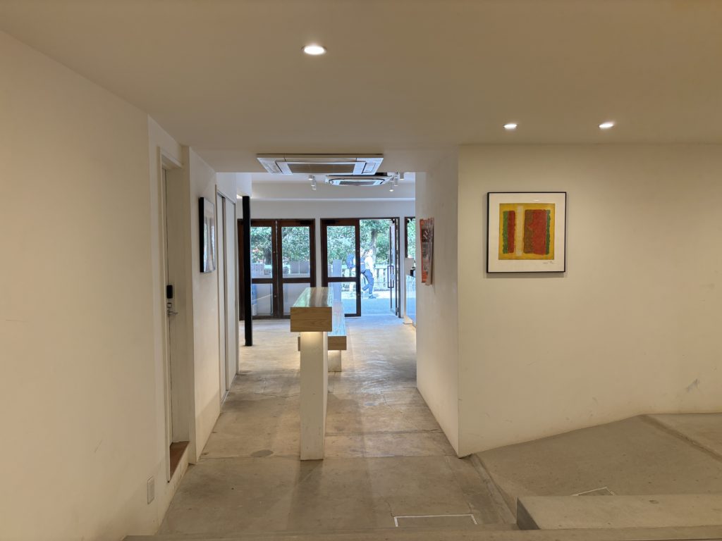 Bright interior of Itsuki Coffee with white walls and wooden accents